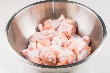 Raw Chicken wings (wingstick) in Stainless steel bowlの写真素材