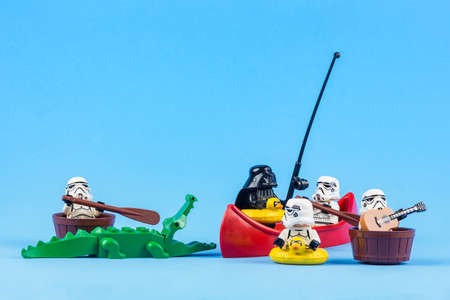 Bangkok, Thailand - June, 08, 2010 : Lego Star Wars is rowing away from the crocodiles isolated on a...