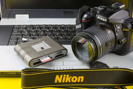 Bangkok, Thailand - March, 31, 2020 : Notebook computer, Card reader and Dslr nikon d5300 isolated...