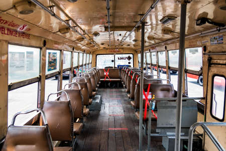 Bangkok, Thailand - April, 01, 2020 : Seat on public buses with signs social distancing protect for...