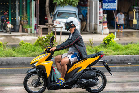 Bangkok, Thailand - June, 23, 2020 : Motion Blurred panning photo of Unidentified name man riding...