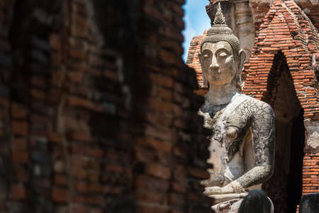 Ayutthaya, Thailand - June, 22, 2020 : Old Buddha statue sitting on brick in Wat Yai Chai Mongkhol temple, Ayutthaya, Thailandのeditorial素材