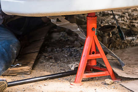 Red Car jack stands support.の写真素材