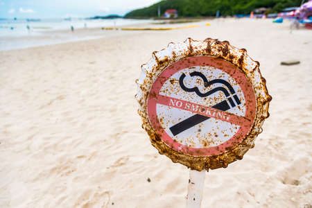 No smoking signs on Tawaen Beach in Koh Larn, Chon Buri, Thailand. Laws of Thailand prohibit smoking on beaches throughout the country.の写真素材