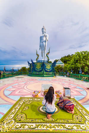 Chon Buri, Thailand - September, 13, 2020 :Unidentified name People make wishes from Naga or serpent statue in Wat khao phra kru temple, Chonburi thailand, The belief of Buddhism, Thai templeのeditorial素材