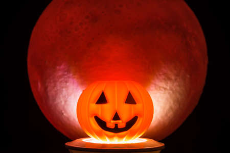 The Horror or scary pumpkin for Halloween Day.There's a red full moon in the background. Halloween...