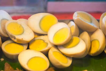 Selective focus of Fried mussel pancakes with egg in big iron frying panの写真素材