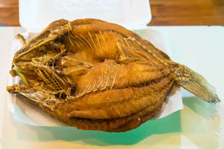 Thailand crispy fried snapper fish with salty sauceの写真素材