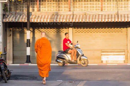Chiangmai, Thailand - October, 10, 2020 :Unidentified name buddhist monk was walking alms offering food in the morning at Chiang Mai, Thailand.のeditorial素材