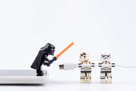 Bangkok, Thailand - November, 13, 2020 : Lego Star Wars is helping to carry a USB cable to charge mobile phones at Bangkok, Thailandのeditorial素材