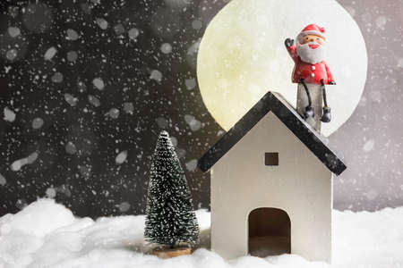 Decorative Christmas decorations, small house on a snowy backgroundの写真素材