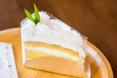 coconut cake on wood plate background in coffee bakery shop Thailand