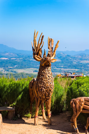 Deer made of wood decorated with a flower garden.の写真素材