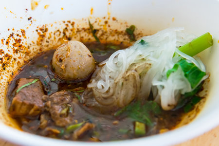 Popular street food in Thailand (Kuai Tiao Moo Namtok) that consisted of pork ball, pork meat, basil...