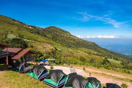 The landscape of the beautiful green mountains. Tourist Attractions and Tentsのeditorial素材