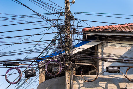 Bangkok, Thailand - February, 04, 2021 : Messy cable electricity post in Bangkok, Thailandのeditorial素材
