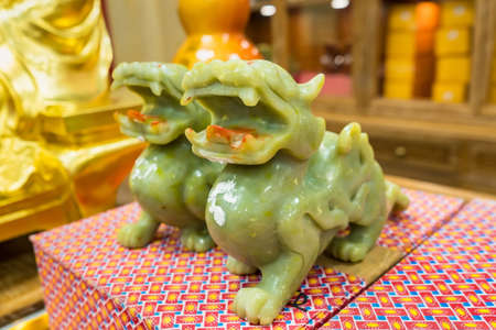 Pair of jade stone Pixiu Dragon Feng Shui sculptures. Pixiu are a Chinese lucky animalの写真素材