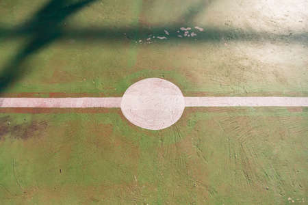 Top view of center point of football field with a green cement floor.の写真素材
