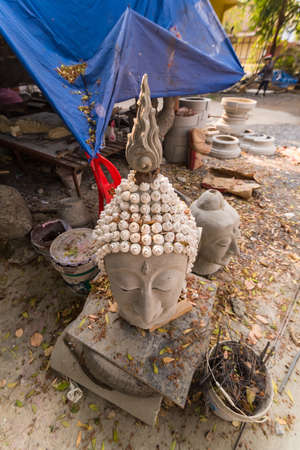 Buddha head made of cement in a Thai templeのeditorial素材