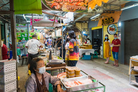 Samut Songkhram, Thailand - April, 04, 2021: Tourists shopping in Amphawa floating market. It is one of the most popular floating markets in Thailand.Many tourists come to travel much less due to the coronavirus outbreak.のeditorial素材