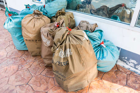 Bangkok, Thailand - March, 25, 2021 : Many big bags filled with parcels, postcards and letters being...