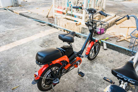 Nonthaburi, Thailand- March, 27, 2021 : Electric Bicycle parking at the park on Koh Kret, Nonthaburi, Thailand.Cycling for tourism reduces pollution, conserves nature and conserves energy.のeditorial素材