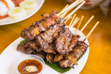 Waki Beef Skewers Grilled on a Charcoal Grill Smells delicious, appetizing, served with hot and spicy dipping sauces.の写真素材