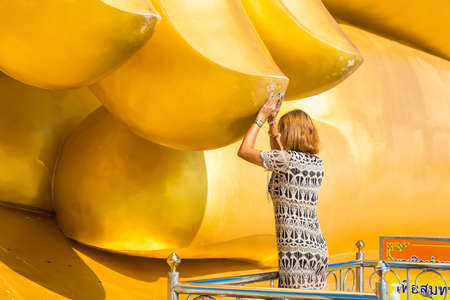 Ang Thong, Thailand-June, 19, 2021 : People to touch The Big Buddha's finger. The Big, Great Buddha of Thailand is one of the main pilgrim and tourist destination in Ang Thong, Thailandのeditorial素材