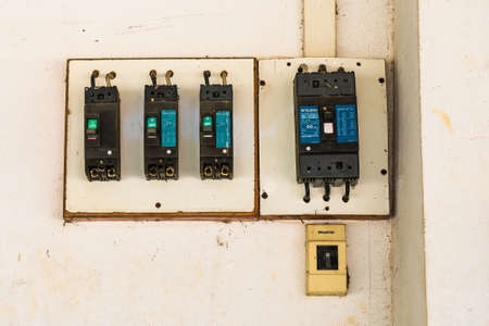Bangkok, Thailand-June, 20, 2021 : Old electrical circuit breaker on the wallのeditorial素材