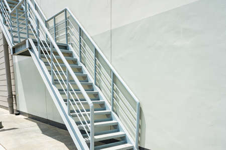 Empty stairs.Steel stair for fire exit door in factory.の写真素材