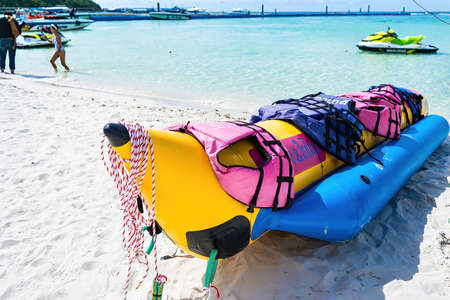 Chon Buri, Thailand - October, 02, 2021 : Inflatable bananas for group skating on the sea. Active...