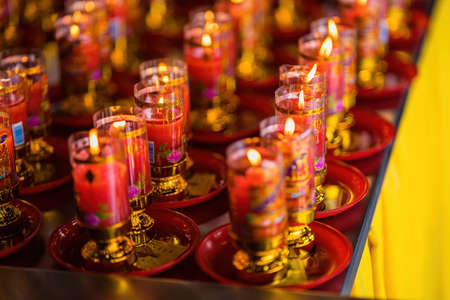 Bangkok, Thailand - December, 20, 2021 : Praying and meditation with burning candle on Chinese temple in Wat Leng Nei Yee 2 Temple at Bangkok, Thailand.のeditorial素材