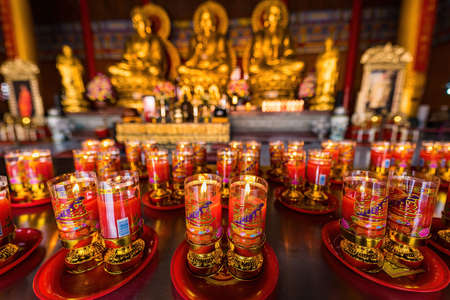Bangkok, Thailand - December, 20, 2021 : Praying and meditation with burning candle on Chinese...