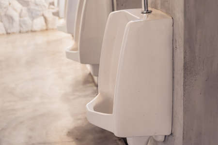white urinals in men's toilet
