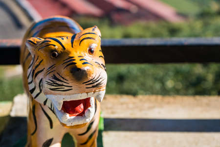 Chiang Rai, Thailand - January, 09, 2021 : Statue of a tiger with the morning sun at Chiang Rai, Thailand.のeditorial素材