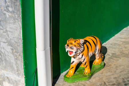 Chiang Rai, Thailand - January, 09, 2021 : Statue of a tiger with the morning sun at Chiang Rai, Thailand.のeditorial素材