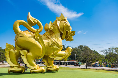 Chiang Rai, Thailand - January, 11, 2022 : Golden Singha state on blue sky background at Singha park Chiangrai Thailand.のeditorial素材