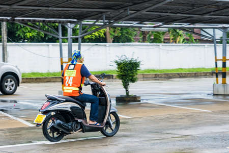 Bangkok, Thailand - September, 25, 2021 : Motion Blurred panning photo of Unidentified name man riding motorcycle in the rain on road at Bangkok, Thailand.Road traffic conceptのeditorial素材