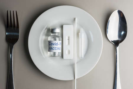 Top view of ceramic plate with Rapid Antigen Test kit with Negative result during swab COVID-19...