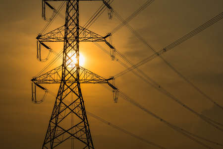 high voltage post,High voltage tower sky sunset background.の写真素材