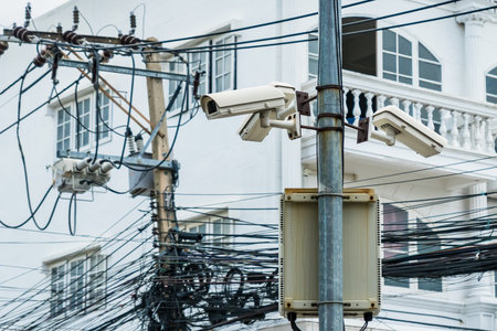 Surveillance cameras on street lampposts.の写真素材