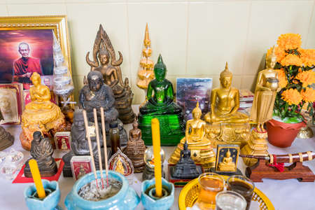 Bangkok, Thailand - September, 25, 2021 :Many Buddha statues were laid together to allow the general public to worship ,Vintage statue old Buddha on shelf in Buddhism' s house ,Buddha shelfのeditorial素材