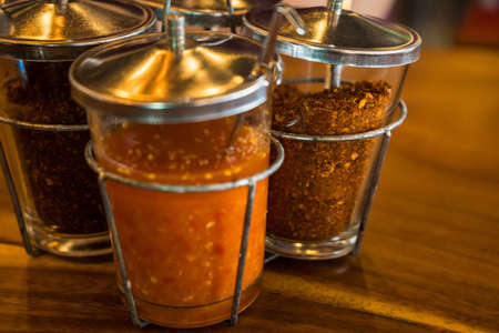 Orange chili pepper in vinegar for cooking. Spices Seasoning Such Sugar Dry Chilli Garnish Set Thai...