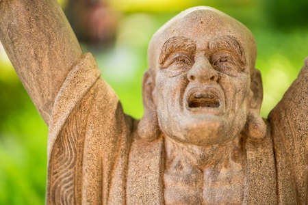 Statue of the chinese god of wealth in Leng Noei Yi 2 or Mangkon Temple in Bangkok, Thailand.の写真素材