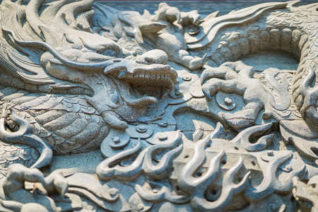 Dragon stucco art temple thailand design architecture old chiness religion at Bangkok, Thailand.