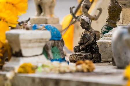 Vintage figurine of traditional Thai ceremonial dancer in temple Thailandの写真素材