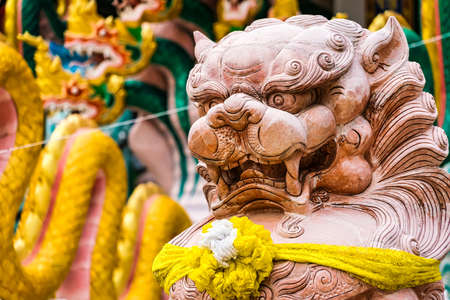 Nakhon Sawan, Thailand - March, 23, 2022 : Stone lion statue at Shrine Serpent king Chan Sen Is a Chinese style temple Created for people to worship gods.のeditorial素材