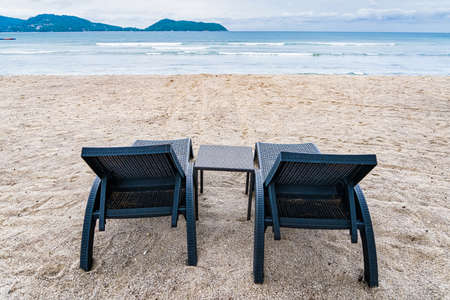Beach Chairs in front of the sea beach - Holiday relaxation background Concept