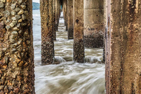 View Under the bridge walkway at the pier from the beach to the sea.Thailand.の写真素材