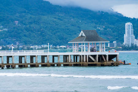 Side view of pier at the beach at morning time.Thailand.の写真素材